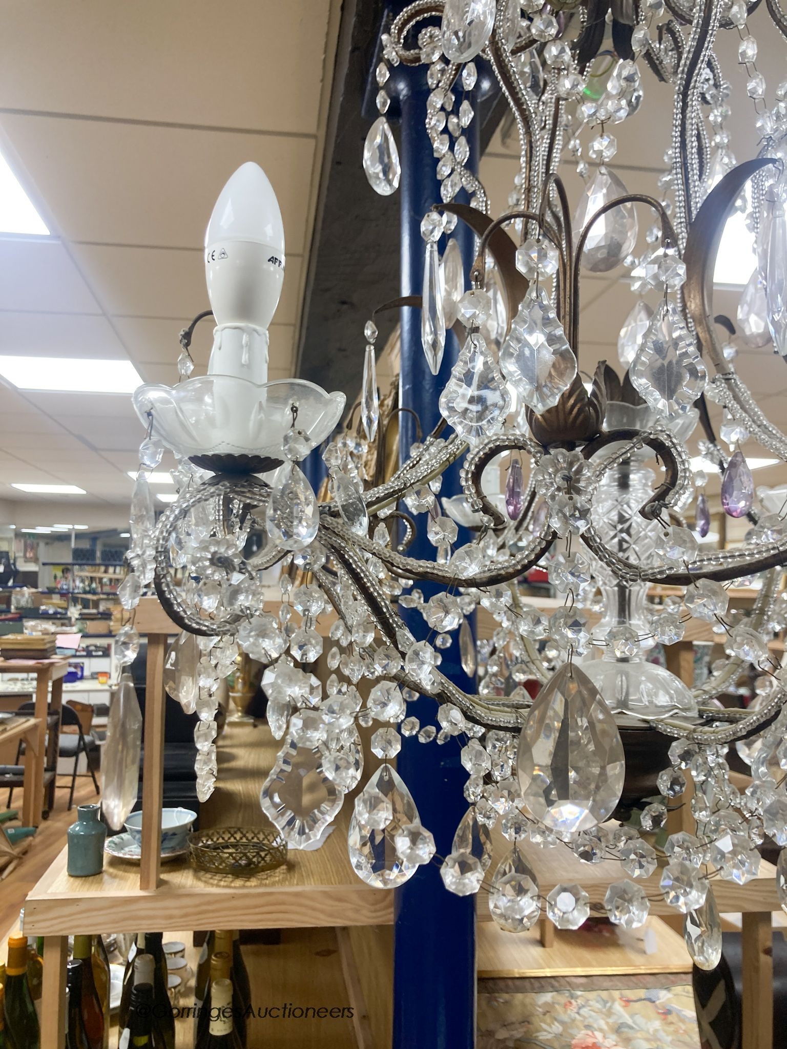 A gilt metal cut glass and lustre hung seven light chandelier 84cm high